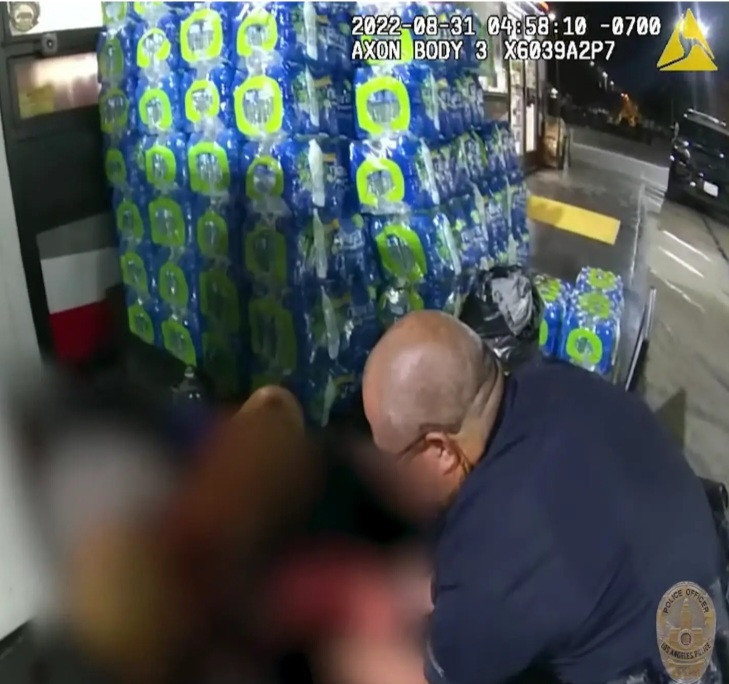 Police officers help woman deliver baby at gas station (video)